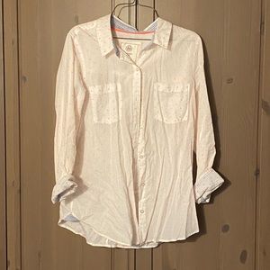 White button up blouse with coral colored dots and light blue embellishments